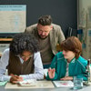 A student and teacher interacting during a dissection.