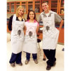 People wearing the Disposable Apron with Frog Graphic